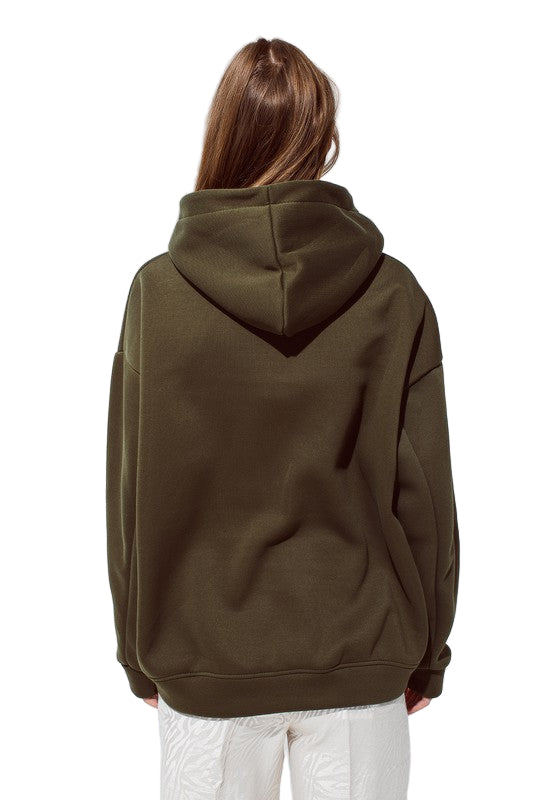 Back view of deep olive colored “C’est La Vie” hoodie showing relaxed oversized fit and smooth soft knit fabric.
