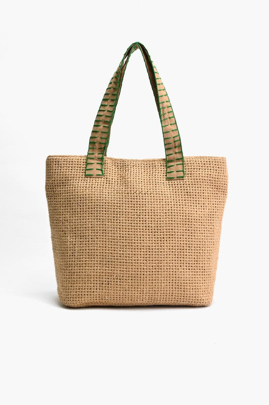 Woven tote bag with green embroidered handles on a white background