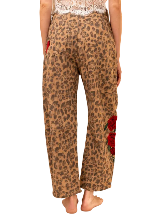 Back view of leopard-print cotton barrel-leg pants with back pockets and rose embroidery