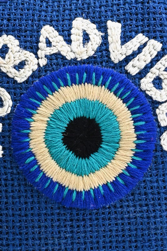 Embroidered patch with circular design on a blue fabric background
