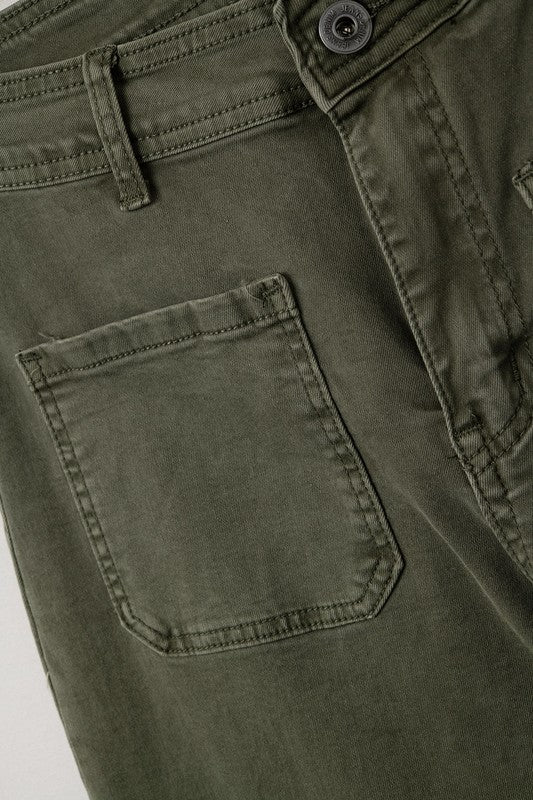 Close-up of Rowan Olive Wide-Leg Pants showing pocket stitching and soft olive fabric texture.