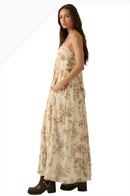 Woman wearing The Marlowe Floral-Print Crepe Tie-Back Halter Maxi Dress Side View