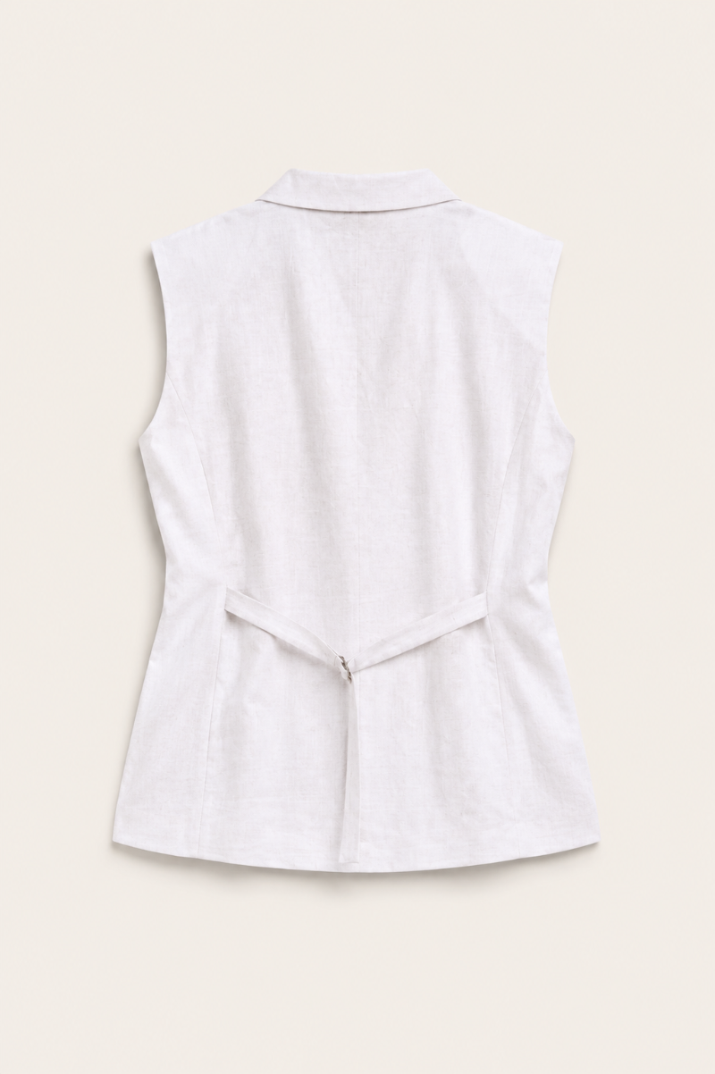 Back view of white linen tailored vest with adjustable waist tab
